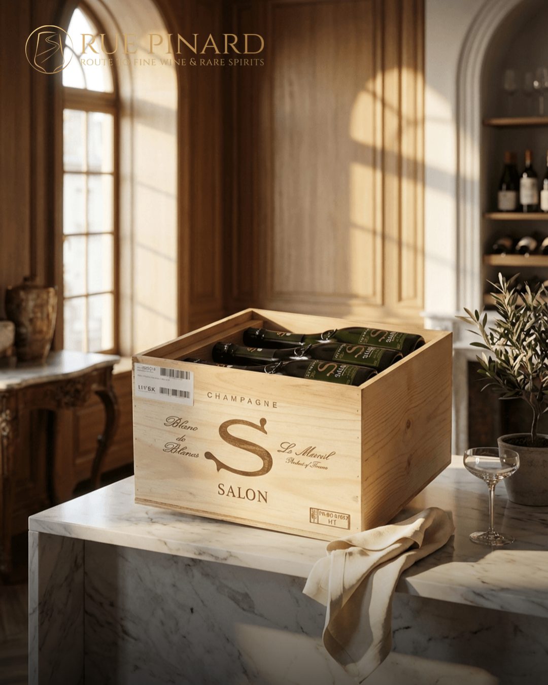 An original wooden case of Salon champagne on a marble counter
